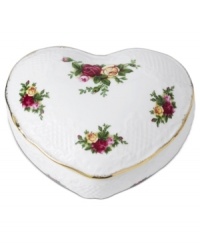 Royal Albert gives yet another reason to love the classic Old Country Roses pattern. A special anniversary piece, the Victorian heart box is crafted of white bone china with subtle lattice texture and brilliant gold trim.