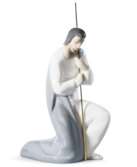 With his shepherd's staff in hand, Joseph kneels before the miracle that is the birth of baby Jesus. Handcrafted by Lladro, this precious figurine is the very essence of Christmas.