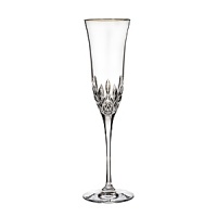 Lismore Essence is the next generation of Waterford's classic Lismore pattern, retaining its brilliance and clarity while incorporating a more slender, modern profile. The classic design, featuring diamond and wedge cuts with a gold rim, is an elegant addition to fine dining occasions.