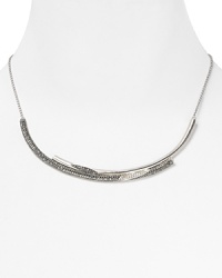 Special and sophisticated. This beautifully crafted Judith Jack collar necklace flaunts effortlessly elegance, dressed up in sterling silver with marcastite stations.