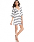 Stripe it rich with Kenneth Cole Reaction's hooded cover up – a Macy's exclusive! This sporty look works well at the beach, pool and beyond!