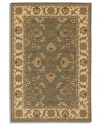 Covered in graceful floral imagery, this area rug will fill your room with color. The Sedona Henna rug is woven from New Zealand worsted wool that has been specially twisted and space-dyed to replicate the look of a hand-woven Peshawar rug. In limestone green with accents of red and beige, this magnificent piece creates an inviting space for gatherings in your home.