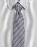 A power style for the power player, crafted in a luxurious silk blend, enhanced with a contrasting thin stripe pattern.About 2½ wide62% silk/38% cottonDry cleanMade in USA of Italian fabric