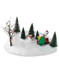 Snoopy and Woodstock clear the ice for a day of skating in this comical collectible from Peanuts Village, by Department 56. A well-lit tree sets a festive scene.