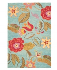 A soothing arrangement. The Blossoms area rug presents ultra-modern florals scattered across a cool blue ground. Woven meticulously in India of soft, long wool fibers, its intricate composition is as attractive as it is durable.