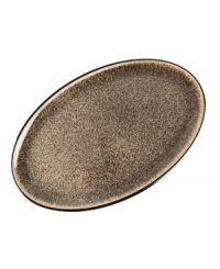 More than meets the eye, Denby's Praline oval platter boasts standout durability in addition to style, carrying your main course hot from the oven and onto your table. With a distinct silhouette in casual stoneware and unique speckled glaze.