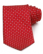 Gancini logos, diamonds and rings alternate in an alluring graphic pattern on this refined tie, rendered in soft Italian silk for a plush hand. Wear it to work and add extra polish to your day.