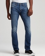 Wiskering and fading lend rugged appeal to these straight leg jeans from Hudson.