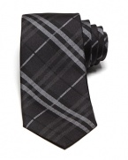 An iconic skinny tie from Burberry London, featuring the brand's signature check print.