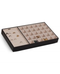 Bury treasure in a drawer with the Blaine jewelry organizer from Mele & Co. A large ring roll and divided sections for chains, pendants, bracelets and more keep every piece in pristine condition. With handsome faux leather exterior.