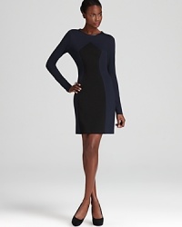 ABS by Allen Schwartz's fitted sweater dress lends a forward look with faux leather detailing and a two-tone design.