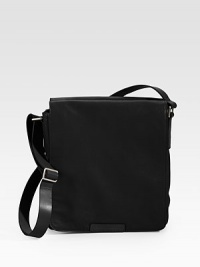 Perfect for sightseeing and the like, this multi-functional bag is crafted in a sleek leather design.Zip closureAdjustable shoulder strapInterior pocket10½W x 13H x 10¼DImported