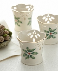 With a scalloped rim and pierced design of holly and berries, this votive set complements the rest of the Holiday collection from Lenox.