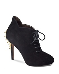 A studded gold-tone plate gives Sam Edelman's basic black suede lace-up bootie edge.