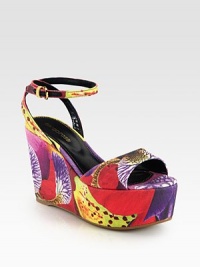 Vivacious floral-print canvas sandal in a platform wedge silhouette with a rubber sole and an adjustable ankle strap. Self-covered wedge, 4 (100mm)Covered platform, 2 (50mm)Compares to a 2 heel (50mm)Printed canvas upperLeather liningRubber solePadded insoleImportedOUR FIT MODEL RECOMMENDS ordering one half size up as this style runs small. 