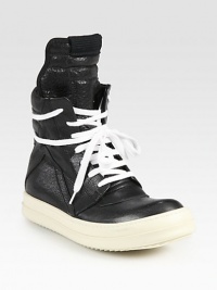 Lace-up leather high top design has a side zipper, unexpected wrap-around laces and subtle perforations at the toe. Rubber platform, 1 (25mm)Leather upperSide zipperLeather liningRubber solePadded insoleMade in ItalyOUR FIT MODEL RECOMMENDS ordering one half size up as this style runs small. 