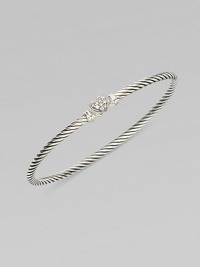 From the Cable Collectibles Collection. Thin sterling silver band with delicate diamond pavé heart.Diamond, 0.11 tcw Sterling silver Width, about 3mm Hook closure Imported 