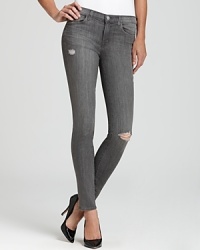 Denim ventures into the grey zone with J Brand skinny jeans, fabricated in a foolproof light grey wash.