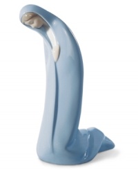 Shrouded in her iconic blue robe, Mary prostrates before baby Jesus. Beautifully handcrafted in Spain with elongated proportions, its purity of form and sentiment makes it a treasure to behold.