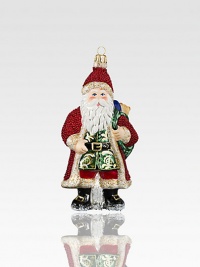 A gorgeously detailed vintage Santa wears rich robes with glitter, beaded textures and intricate patterns, all crafted of mouth-blown, hand-painted glass, an exquisite heirloom for your tree.Glass6.5H X 3W X 2.5DImported