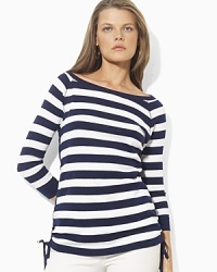 Bold stripes grace the front of a three-quarter-sleeve tee, crafted with an elegant ballet neckline and drawcord detailing at the hem to create chic ruching.