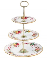 Royal Albert offers a festive twist on a favorite pattern, mixing Christmas trees, holly and bows with pink and gold blooms on the Old Country Roses Holiday tiered cake plate. Gold-banded porcelain coordinates flawlessly with the original dinnerware collection.