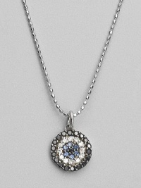 Rings of mysterious black diamonds, sparkling white diamonds and cool blue sapphires make a glamorous pendant set in 14k white gold. Diamonds, 0.26 tcw Sapphires 14k white gold Chain length, about 16 Medallion diameter, about ½ Lobster clasp Imported