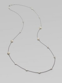 From the Windsor Collection. A long and lovely chain of textured oval links is sprinkled with shapely little medallions sparked white sapphires. White sapphires Sterling silver and 18k yellow gold Length, about 34 Lobster clasp Imported