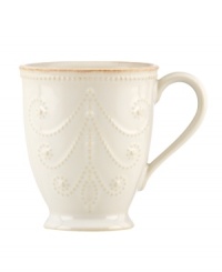 With fanciful beading and an antiqued edge, this mug from the Lenox French Perle white dinnerware collection has an irresistibly old-fashioned sensibility. Hard-wearing stoneware is dishwasher safe and, in soft white hue, a graceful addition to every meal.