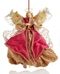 A soothing presence throughout the season, this Holiday Lane angel ornaments your tree with wings of shimmering gold and festive red. Her sparkling harp sets the tone for every holiday.