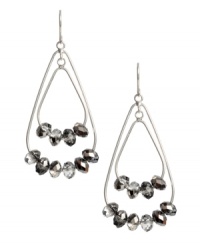 Nothing says stylish more than bold, statement earrings. Kenenth Cole New York design features double teardrops decorated with glittering glass beads set in silver tone mixed metal. Approximate drop: 1-3/4 inches.