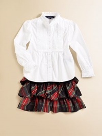 Traditional tartan plaid is crafted into a flirty tiered skirt accented with a flurry of ruffles for a fun, stylish touch.Elastic waistbandTiered ruffle constructionPolyesterDry cleanImported