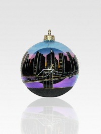 This hand-painted keepsake captures the magic of the Manhattan skyline, with its million sparkling lights and sky-scraping spires! Polonaise hand-blown glass About 4 in diameter Made in Poland