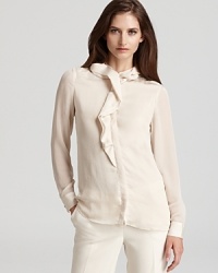 A decadently ruffled neckline sprawls down a sheer Jones New York Collection blouse for an effortlessly romantic look.