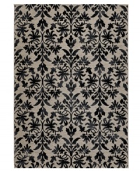 Reflections of Tibet. The Couristan Everest area rug features a beautiful floral pattern in shades of grey and black, crafted from thick-pile polypropylene that imparts a natural appearance and soft, luxurious finish.