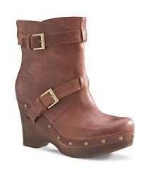 UGG® Australia rides the tough-chic moto trend in these stylish booties with a tender secret: sheepskin linings.