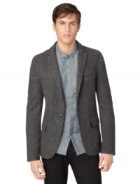 This Calvin Klein Jeans blazer offers a classic look that can be dressed up or down for versatile style.