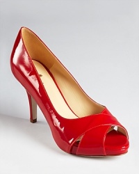 Lipstick red patent leather lends a slick, glossy look to kate spade new york's Billie pumps.