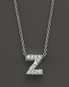 From the Tiny Treasures collection, a diamond Z necklace. With signature ruby accent. Designed by Roberto Coin.