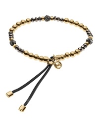 This Michael Kors bracelet stretches to fit and features adjustable leather ties for comfort. The beaded design will fit in well when layered with your other favorite bangles. Stack them up!