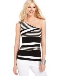 A sultry one-shoulder top from Vince Camuto is designed in a modern tiered silhouette with crisp contrast stripes for a graphic pop. Stacked bangles and bright white pants provide an utterly chic accompaniment.