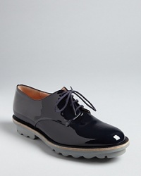 Robert Clergerie gives the oxford trend polish in these stylish lace ups, grounded with rugged, rubber soles.