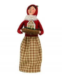 Start every holiday season on a sweet note. This rosy-cheeked woman is bundled tight, caroling door to door and delivering yummy treats with the rest of the Gingerbread Family figurines, all handcrafted by Byers' Choice.