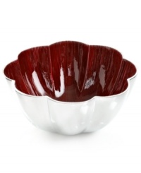 More than conversation blossoms around your table with the handcrafted Red Lotus bowl from Simply Designz. Polished aluminum lined in glossy enamel lends fresh color and shine to any dining area.