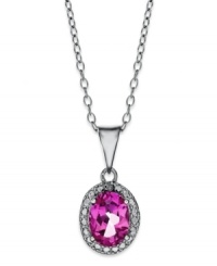 Pretty in pink. Victoria Townsend's polished pendant features an oval-cut pink topaz (1-1/8 ct. t.w.) surrounded by diamond accents. Set in sterling silver. Approximate length: 18 inches. Approximate drop: 3/4 inch.