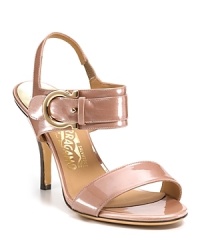 In gleaming metallic patent, the Brianna sandals boast the brand's signature gancio detail at the ankle. From Salvatore Ferragamo.