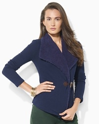 A cozy fleece cardigan is accented with plush faux shearling at the neckline and a heritage toggle closure.