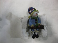 Smiling Snowman X-Games Skiier Shelf / Fireplace Mantle Sitter! Snowman Is Wearing a Dark Blue Striped Hat & Baby Blue Jacket And Is Holding His Skis. A Fun, Colorful, & Festive Addition To Your Family's Christmas Decorations. Numerous Additional Coordina