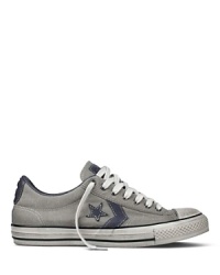 John Varvatos updates the converse allstar with a weathered canvas upper and a muted star-and-stripe overlay at the sides.