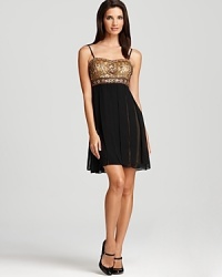 A dazzling, beaded bodice teams with a grosgrain ribbon skirt on this Sue Wong mini dress.